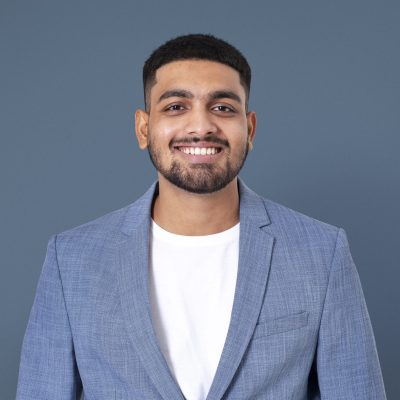 Cheerful Indian businessman smiling closeup portrait for jobs and career campaign